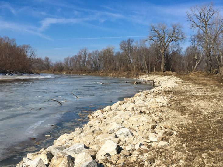 Riprap along a river bank in winter