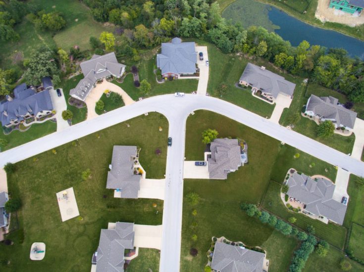 Houses sitting on a roadway in a subdivision