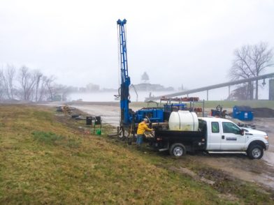 A drill rig being operated in the fog