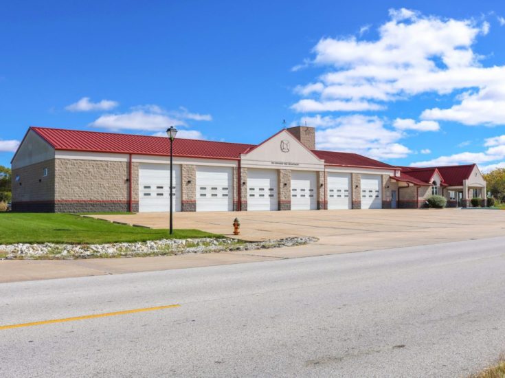 View of the fire station and vehicle bays from the road