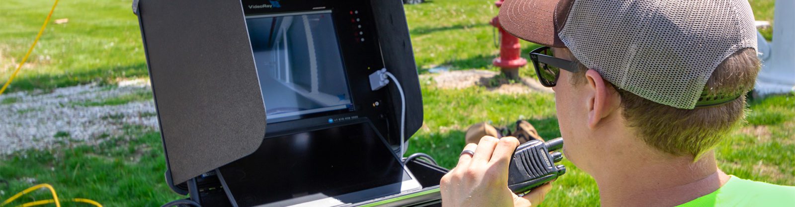 A man looking at video screen to operate an ROV