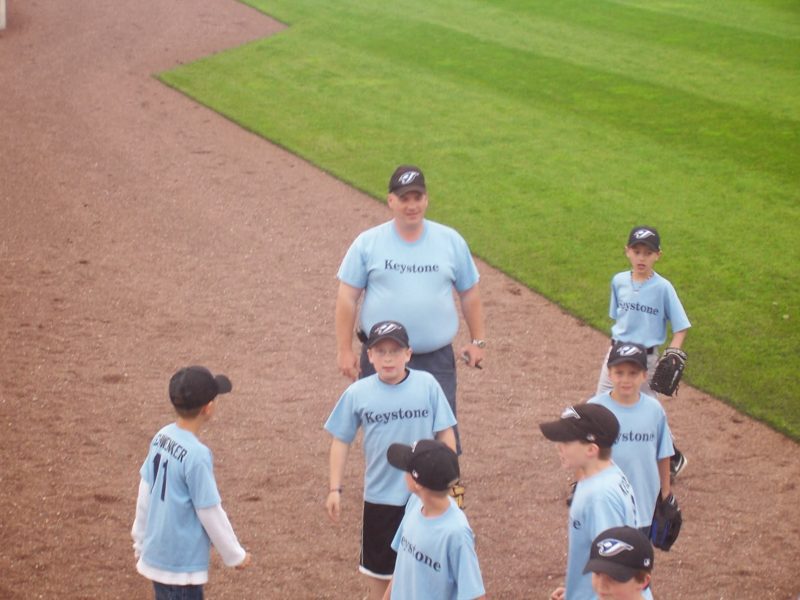 Bryan coaching a little league team