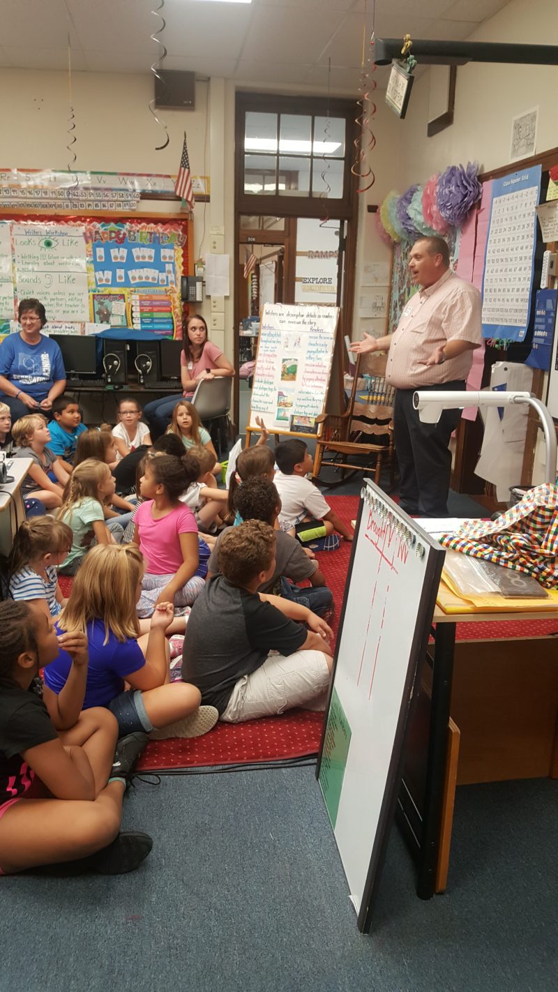 Bryan talking to grade school students about critical thinking skills