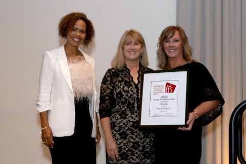 Heather Olson (right) accepting the award