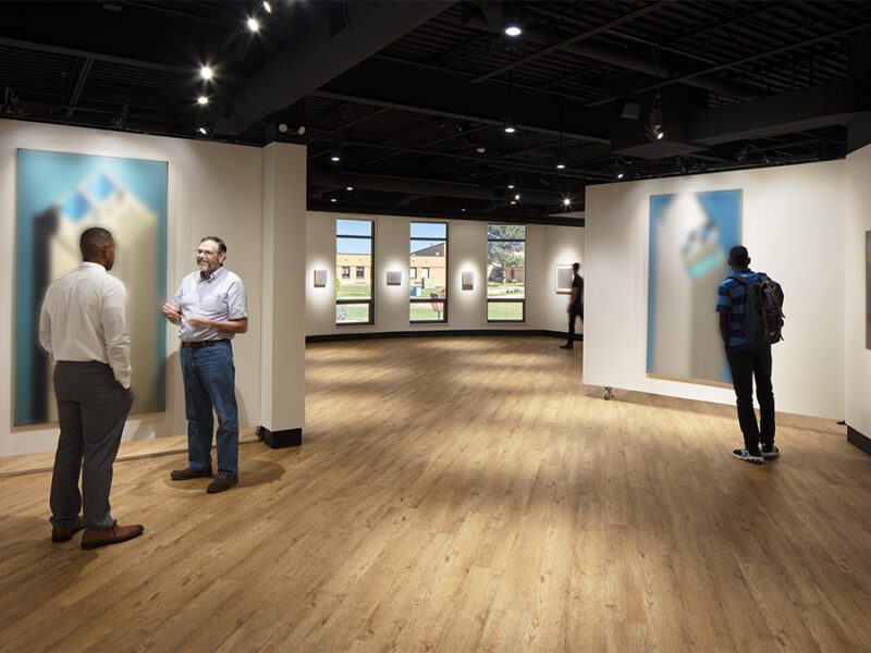 People talking and viewing art at the Murray Art Gallery. [AJ Brown Photography]