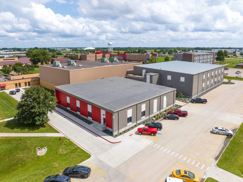 An aerial view of a gray and red building on the SCC campus