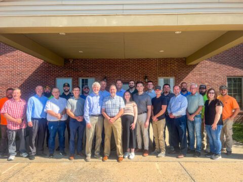 The Klingner executive team with the Koehler employees in front of the office