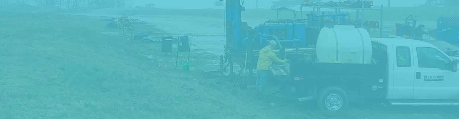 A man standing at a drill rig
